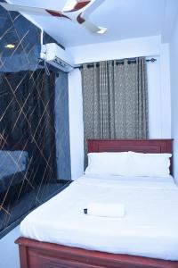 Postel nebo postele na pokoji v ubytování Ez Stay Guesthouse