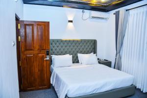 Postel nebo postele na pokoji v ubytování Ez Stay Guesthouse