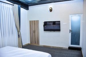 Postel nebo postele na pokoji v ubytování Ez Stay Guesthouse
