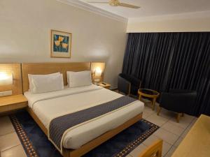 Postel nebo postele na pokoji v ubytování Harrisons Hotel