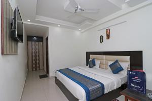 Ένα ή περισσότερα κρεβάτια σε δωμάτιο στο Super Hotel O Sweet Palace