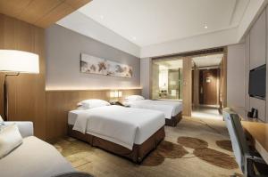 TV a/nebo společenská místnost v ubytování Crowne Plaza Fuzhou Riverside by IHG