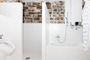 a bathroom with a shower and a toilet at Boutique House Anni in Piran +38 photos