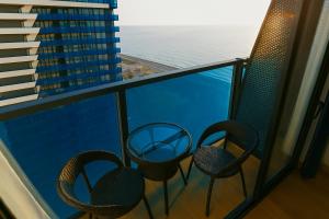 A balcony or terrace at DOWNTOWN Centre in Batumi Aparthotel Orbi City N1