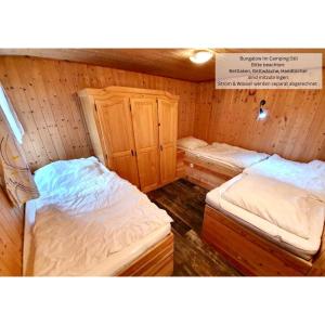Postel nebo postele na pokoji v ubytování Feriensiedlung Schwalbennest