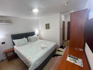 Postel nebo postele na pokoji v ubytování Hotel Square