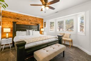 a bedroom with a bed and a ceiling fan at Hummingbird Corner Pet Friendly Great Location Jacuzzi in Big Bear Lake