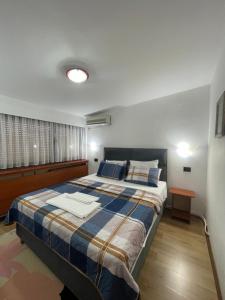 Postel nebo postele na pokoji v ubytování Hotel Square