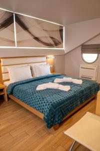 Postel nebo postele na pokoji v ubytování Hotel Epavlis Eleftheriadi + 37 fotografií