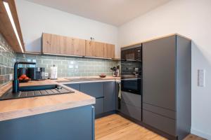 Η κουζίνα ή μικρή κουζίνα στο Nordseeblick Wohnung Möwe +36 φωτογραφίες
