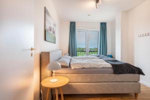 Ένα ή περισσότερα κρεβάτια σε δωμάτιο στο Nordseeblick Wohnung Möwe