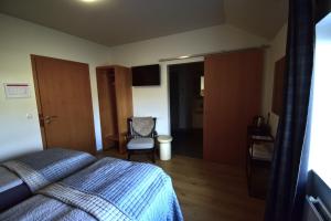 A bed or beds in a room at Glacier World - Hoffell Guesthouse