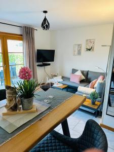 a living room with a table and a couch at Fördefarm-Natura in Westerholz