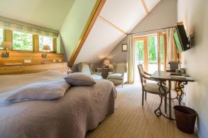 Postel nebo postele na pokoji v ubytování Relais & Chateaux Hotel Landgoed Het Roode Koper + 37 fotografií