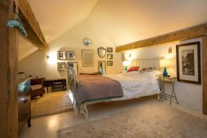 Postel nebo postele na pokoji v ubytování Beudy-Mach