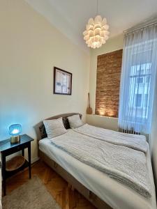 Posteľ alebo postele v izbe v ubytovaní SLEEP'N with Air Conditioner