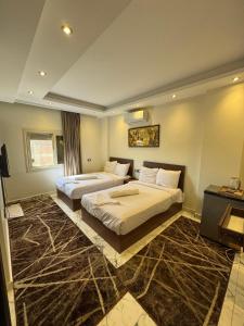 Ένα ή περισσότερα κρεβάτια σε δωμάτιο στο Unique Pyramids Inn