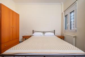 Un pat sau paturi într-o cameră la Centrale +3 fotografii