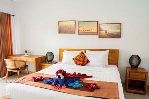 Postel nebo postele na pokoji v ubytování Bali intan Canggu