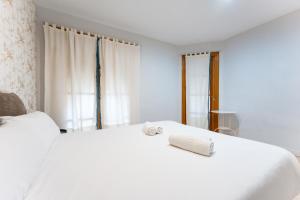 A bed or beds in a room at BHost - The Special One