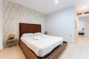A bed or beds in a room at BHost - The Special One
