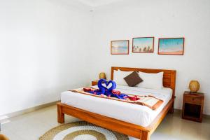 Postel nebo postele na pokoji v ubytování Bali intan Canggu