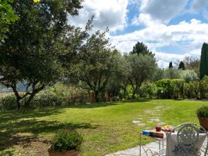 A garden outside Villa Monica by Interhome