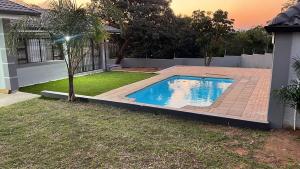 a swimming pool in the yard of a house at 8 on Lorenzo in Amanzimtoti