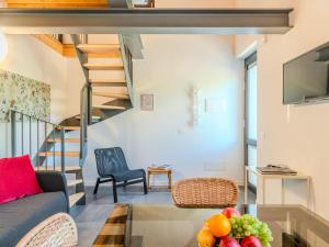 a living room with a couch and a glass table at Apartment Camping Turisport-4 by Interhome in Dervio