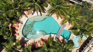 an aerial view of a swimming pool with palm trees at Lapili Residence in Kiwengwa