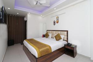 Ένα ή περισσότερα κρεβάτια σε δωμάτιο στο Super Hotel O Sweet Palace +14 φωτογραφίες