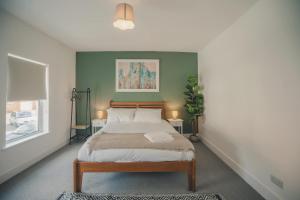 Ένα ή περισσότερα κρεβάτια σε δωμάτιο στο Charming 3 Bedroom Home with Garden in Banbury