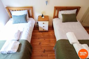 Letto o letti in una camera di Atlantic View Retreat