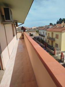 a balcony with a view of a city at Big Apartment in Assemini
