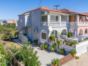 a villa with a view of the house at Donna's luxury home in Kassiopi 300m from the sea in Kassiopi
