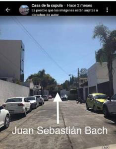 a picture of a street with cars parked on the road at Casa de la cúpula in Morelia