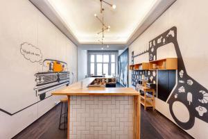 a kitchen with a stove and a counter top at Adagio Hostel Basilica in Budapest