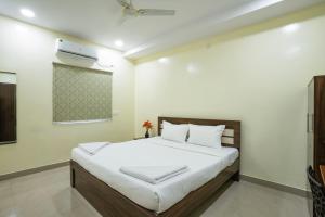 Ένα ή περισσότερα κρεβάτια σε δωμάτιο στο Hotel Marigold Kokapet- A Business Hotel