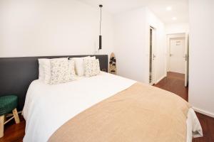 Ένα ή περισσότερα κρεβάτια σε δωμάτιο στο Costa Nova Premium Apartment & Pool +70 φωτογραφίες