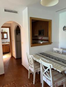 a kitchen and dining room with a table and chairs at Vera playa in Vera