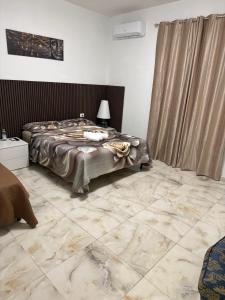 Letto o letti in una camera di Casa Rosa