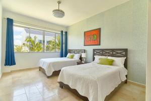 Postel nebo postele na pokoji v ubytování Cap Cana apartment pool and beach access + 56 fotografií