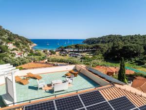 a house with solar panels on the roof at Hotel Galli - Wellness & Spa in Fetovaia +42 photos