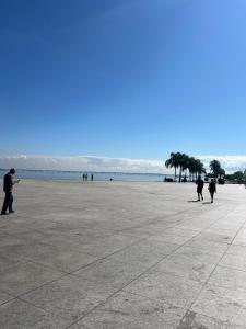 a group of people walking on the beach at Bandeira do Brasil in Rio de Janeiro +15 photos