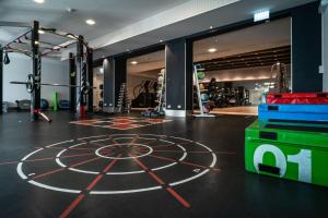 a gym with a dart board on the floor at Crowne Plaza Zürich by IHG in Zurich