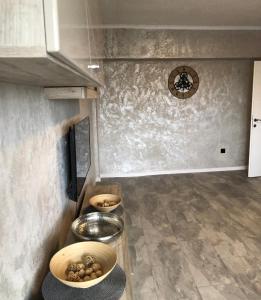 a kitchen with bowls of food on a counter at Alfredo Apartament in Buzau