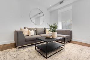 a living room with a couch and a table at The SFX Old Port in Montréal +178 photos