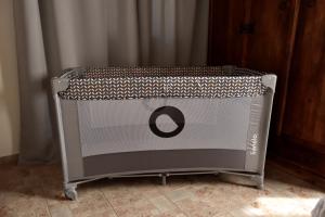 a metal crib with a letter o on it at Irida in Káto Zákros +29 photos