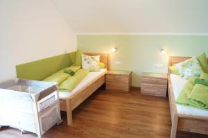 Postel nebo postele na pokoji v ubytování Löschgruberhof - Urlaub am Bauernhof