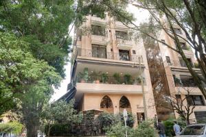 a building with a balcony on the side of it at Edificio Fenicia Loft Laureles in Medellín +6 photos